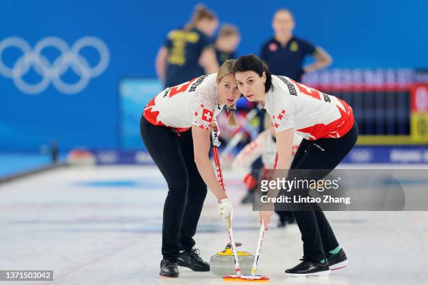 Melanie Barbezat and Esther Neuenschwander of Team Switzerland compete against Team Sweden during the Women's Bronze Medal Game on Day 14 of the...
