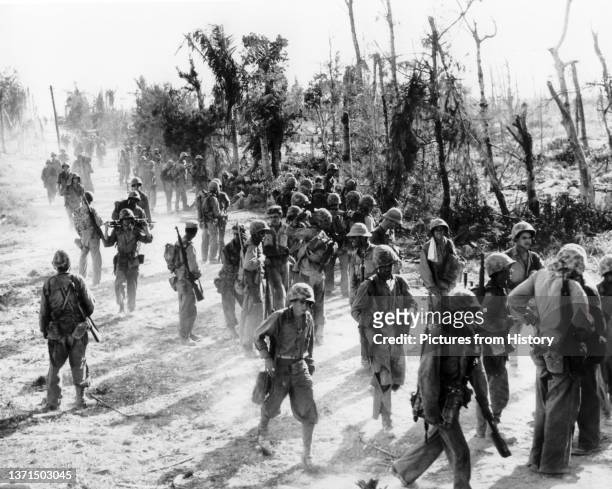 Marines of the 5th Marine Regiment, 1st Marine Division return from the hard fighting at Bloody Nose Ridge on Peleliu, Battle of Peleliu,...