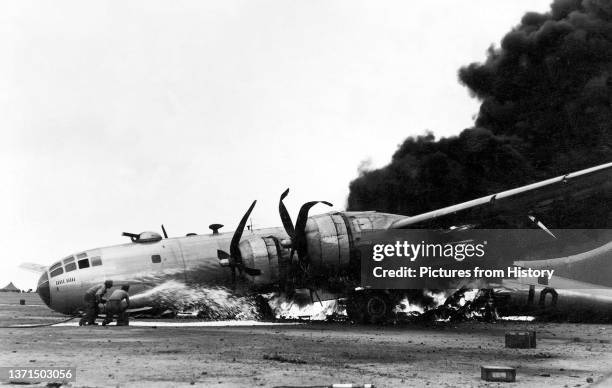 Boeing B-29 in flames after an emergency landing at Iwo Jima, Battle of Iwo Jima, March 1945.