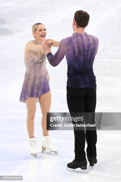 Alexa Knierim and Brandon Frazier of Team United States react after skating during the Pair Skating Free Skating on day fifteen of the Beijing 2022...