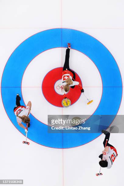 Melanie Barbezat, Silvana Tirinzoni and Esther Neuenschwander of Team Switzerland compete against Team Sweden during the Women's Bronze Medal Game on...