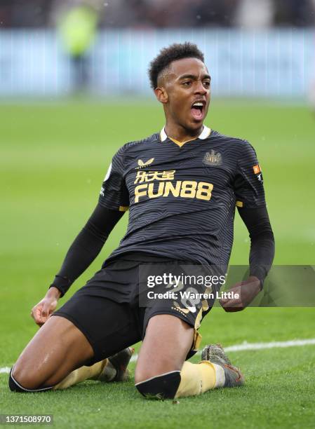 Joe Willock of Newcastle United celebrates after scoring their team's first goal during the Premier League match between West Ham United and...