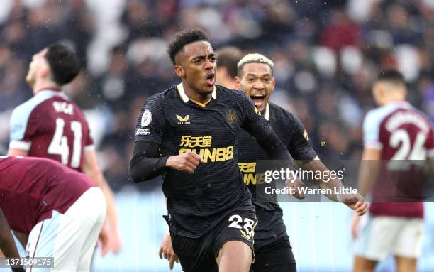 Joe Willock of Newcastle United celebrates after scoring their team's first goal during the Premier League match between West Ham United and...