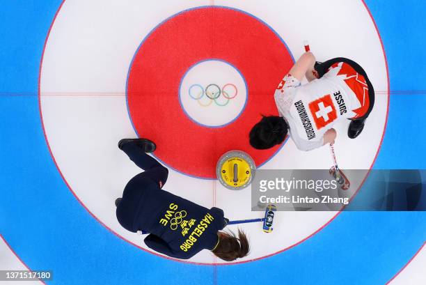 Esther Neuenschwander of Team Switzerland and Anna Hasselborg of Team Sweden compete during the Women's Bronze Medal Game on Day 14 of the Beijing...