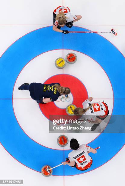 Alina Paetz, Melanie Barbezat and Esther Neuenschwander of Team Switzerland and Sara McManus of Team Sweden compete during the Women's Bronze Medal...