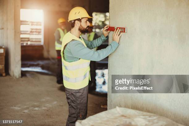 young bearded male construction worker - school reform stock pictures, royalty-free photos & images