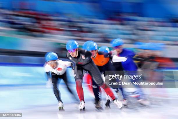 Valerie Maltais of Team Canada and Nana Takagi of Team Japan skate during the Women's Mass Start Semifinals on day fifteen of the Beijing 2022 Winter...