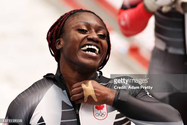 Cynthia Appiah of Team Canada celebrates during the 2-woman Bobsleigh Heat 4 on day 15 of Beijing 2022 Winter Olympic Games at National Sliding...