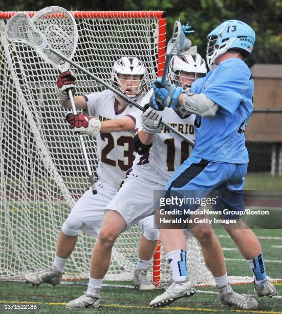 Medfield's Nigel Reiff unleashes a first period shot of Concord Carlisle goal Aida Long as his teammate Ethan vanderWilden defends on Saturday,June...