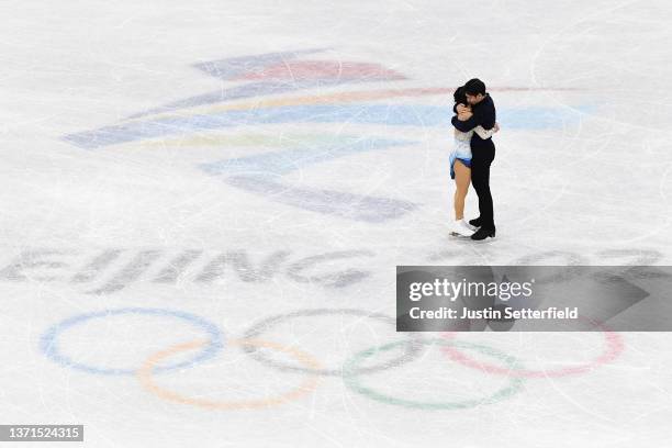 Wenjing Sui and Cong Han of Team China react after skating during the Pair Skating Free Skating on day fifteen of the Beijing 2022 Winter Olympic...