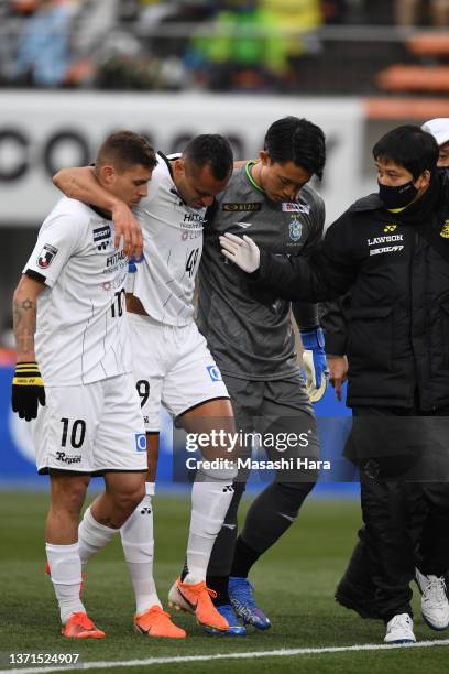 Kosei Tani of Shonan Bellmare supports Douglas of Kashiwa Reysol when he injured during the J.LEAGUE Meiji Yasuda J1 1st Sec. Match between Shonan...