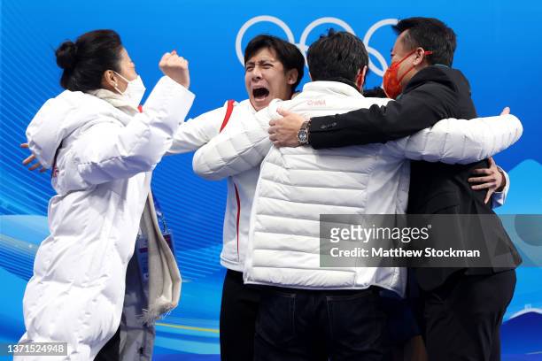 Wenjing Sui and Cong Han of Team China celebrate with team members after winning the Gold medal during the Pair Skating Free Skating on day fifteen...