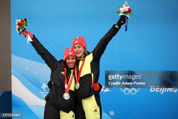 Silver medal winners Mariama Jamanka and Alexandra Burghardt of Team Germany celebrate the podium during the flower ceremony following the 2-woman...