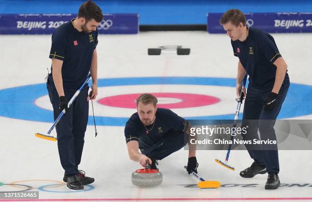 Oskar Eriksson, Rasmus Wranaa and Christoffer Sundgren of Team Sweden compete against Team Great Britain during the Men's Curling Gold Medal Game on...