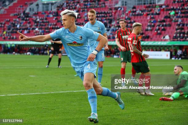Nico Schlotterbeck of SC Freiburg celebrates after scoring their team's second goal during the Bundesliga match between FC Augsburg and Sport-Club...