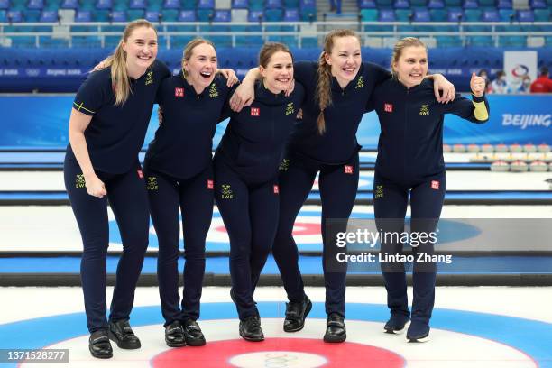 Sara Mcmanus, Sofia Mabergs, Anna Hasselborg, Agnes Knochenhauer and Johanna Heldin of Team Sweden celebrate victory against Team Switzerland during...