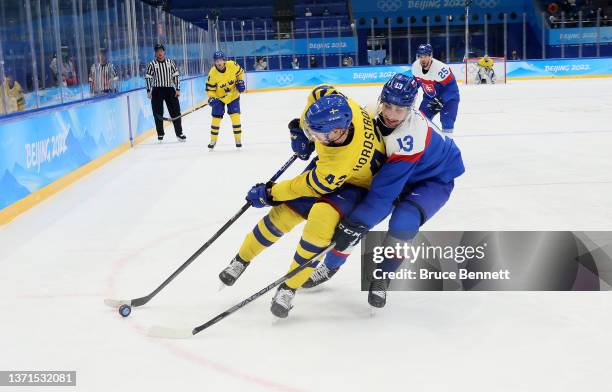 Joakim Nordstrom of Team Sweden is challenged by Tomas Jurco of Team Slovakia in the third period during the Men's Ice Hockey Bronze Medal match...