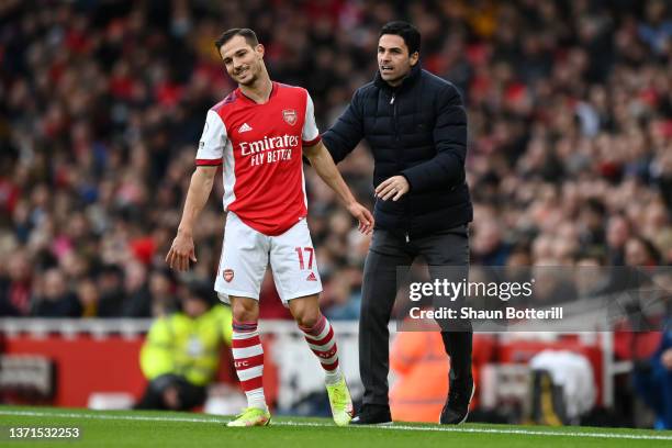 Cedric Soares of Arsenal is encouraged by Mikel Arteta, Manager of Arsenal during the Premier League match between Arsenal and Brentford at Emirates...