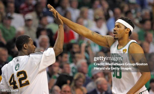 Boston Celtics guard Tony Allen and center Rasheed Wallace celebrate during the fourth quarter in Game 5 of the NBA Finals at the TD Garden Sunday,...