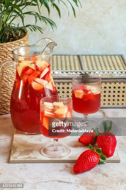strawberry sangria aperitif drink for summer party - cocktail and mocktail stock pictures, royalty-free photos & images