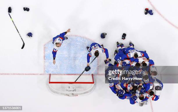 Team Slovakia celebrates a victory after the Men's Ice Hockey Bronze Medal match between Team Sweden and Team Slovakia on Day 15 of the Beijing 2022...