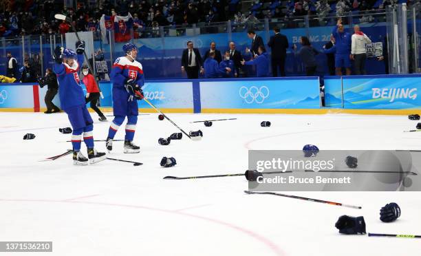 Libor Hudacek and Kristian Pospisil of Team Slovakia celebrate a victory after the Men's Ice Hockey Bronze Medal match between Team Sweden and Team...