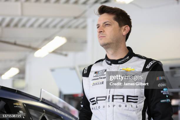 Landon Cassill, driver of the FOX Nation Chevrolet, looks on in the garage area during practice for NASCAR Cup Series 64th Annual Daytona 500 at...