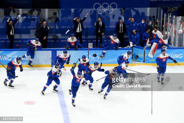 Team Slovakia celebrates a victory after the Men's Ice Hockey Bronze Medal match between Team Sweden and Team Slovakia on Day 15 of the Beijing 2022...