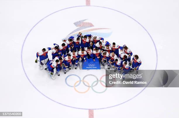 Team Slovakia poses during the Bronze Medal ceremony after the Men's Ice Hockey Bronze Medal match between Team Sweden and Team Slovakia on Day 15 of...