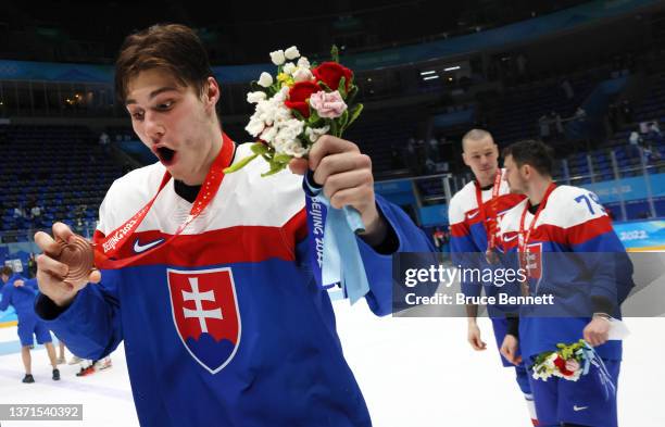 Juraj Slafkovsky of Team Slovakia holds up the Bronze Medal after the Men's Ice Hockey Bronze Medal match between Team Sweden and Team Slovakia on...