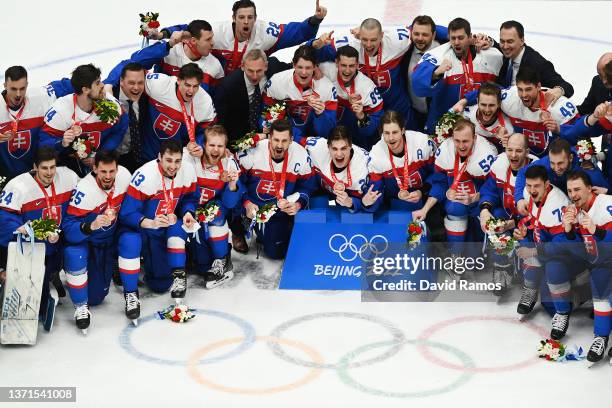 Team Slovakia poses during the Bronze Medal ceremony after the Men's Ice Hockey Bronze Medal match between Team Sweden and Team Slovakia on Day 15 of...