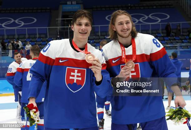 Juraj Slafkovsky and Pavol Regenda of Team Slovakia celebrate winning the Bronze Medal after the Men's Ice Hockey Bronze Medal match between Team...