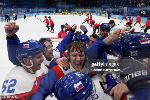 Michal Cajkovsky of Team Slovakia celebrates a victory with their team after the Men's Ice Hockey Bronze Medal match between Team Sweden and Team...