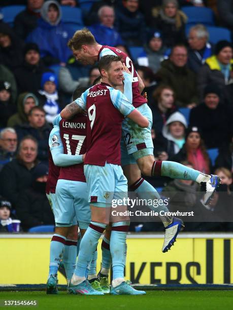 Aaron Lennon of Burnley celebrates after scoring their side's third goal with team mates during the Premier League match between Brighton & Hove...