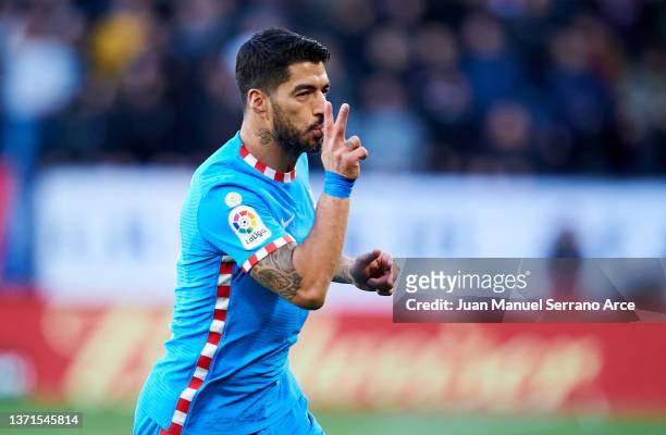 Luis Suarez of Club Atletico de Madrid celebrates after scoring his team's second goal during the LaLiga Santander match between CA Osasuna and Club...