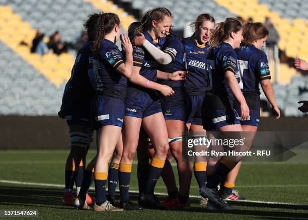 Vicky Laflin of Worcester Warriors celebrates scoring a try during the Women's Allianz Premier 15s match between Worcester Warriors Women and DMP...
