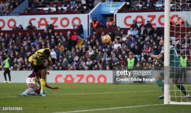 Emmanuel Dennis of Watford FC scores their side's first goal during the Premier League match between Aston Villa and Watford at Villa Park on...