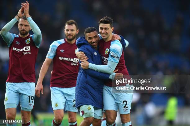 Aaron Lennon of Burnley embraces Matthew Lowton following their sides victory in the Premier League match between Brighton & Hove Albion and Burnley...