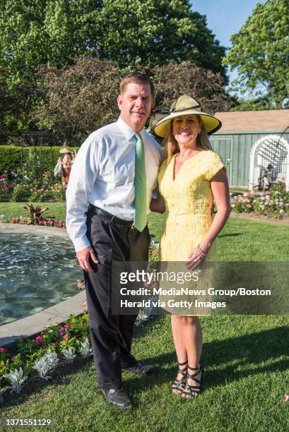 - Mayor Marty Walsh, left, poses for a photo with his partner Lorrie Higgins, right, at the Rose Garden during the 21st Annual Rose Garden Party to...