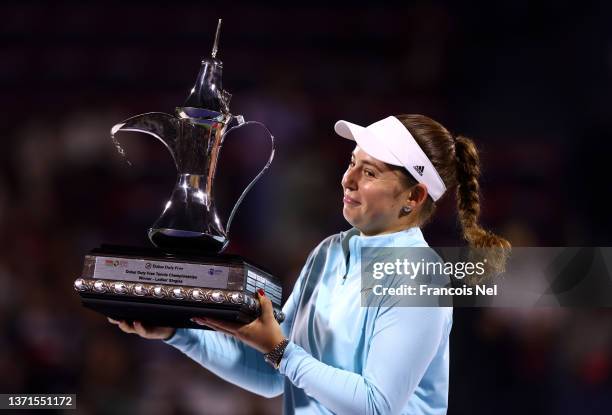 Jelena Ostapenko of Latvia celebrates with the trophy following victory on day six of the Dubai Duty Free Tennis at Dubai Duty Free Tennis Stadium on...