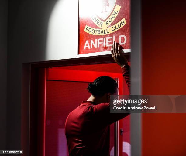 Virgil van Dijk of Liverpool touching the "This is Anfield" sign during the Premier League match between Liverpool and Norwich City at Anfield on...