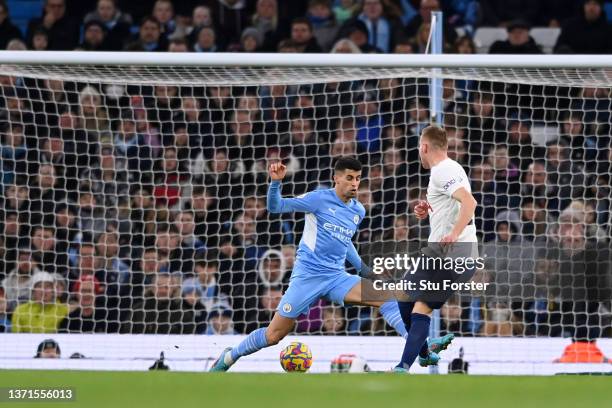 Dejan Kulusevski of Tottenham Hotspur scores their team's first goal during the Premier League match between Manchester City and Tottenham Hotspur at...