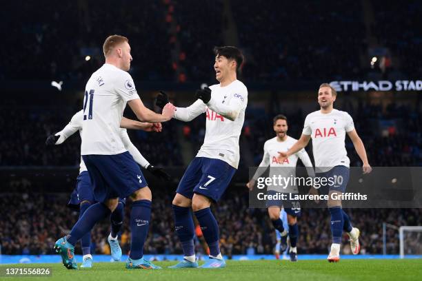 Dejan Kulusevski of Tottenham Hotspur celebrates after scoring their side's first goal with Heung-Min Son during the Premier League match between...
