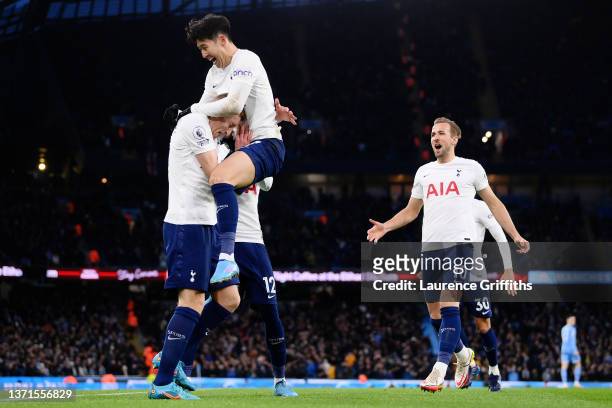 Dejan Kulusevski of Tottenham Hotspur celebrates after scoring their side's first goal with Heung-Min Son and Harry Kane during the Premier League...