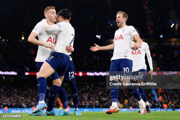 Dejan Kulusevski of Tottenham Hotspur celebrates after scoring their side's first goal with Heung-Min Son and Harry Kane during the Premier League...