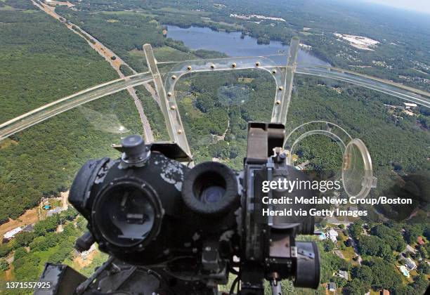 Lawrence, MA) The view from the chin turret and the bombardier's seat aboard the Liberty Belle, a World War II era B-17 Bomber, as it flies over the...