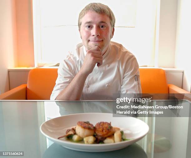 Great Bay Chef Lee Chizmar sits with a Day Boat seared scallop dish with potato gnocchi, chantelle mushrooms, pea tendrils, english peas and a pea...