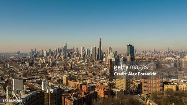 manhattan skyline - aerial remote view over brooklyn, new york, usa. - finance and economy stock pictures, royalty-free photos & images