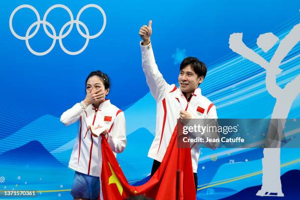 Wenjing Sui and Cong Han of Team China celebrate winning the Gold medal at 'kiss and cry' during the Pair Skating Free Skating on day fifteen of the...