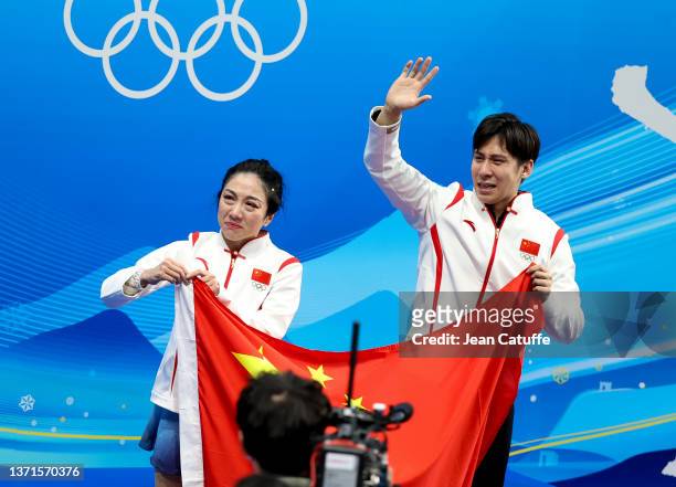 Wenjing Sui and Cong Han of Team China celebrate winning the Gold medal at 'kiss and cry' during the Pair Skating Free Skating on day fifteen of the...